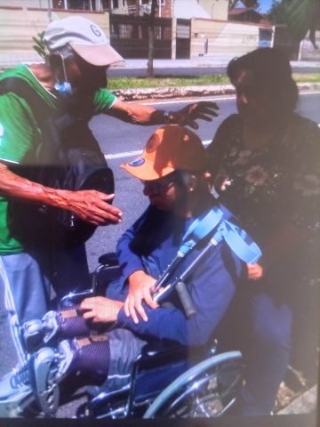 7 Gonzalo praying for disable young man